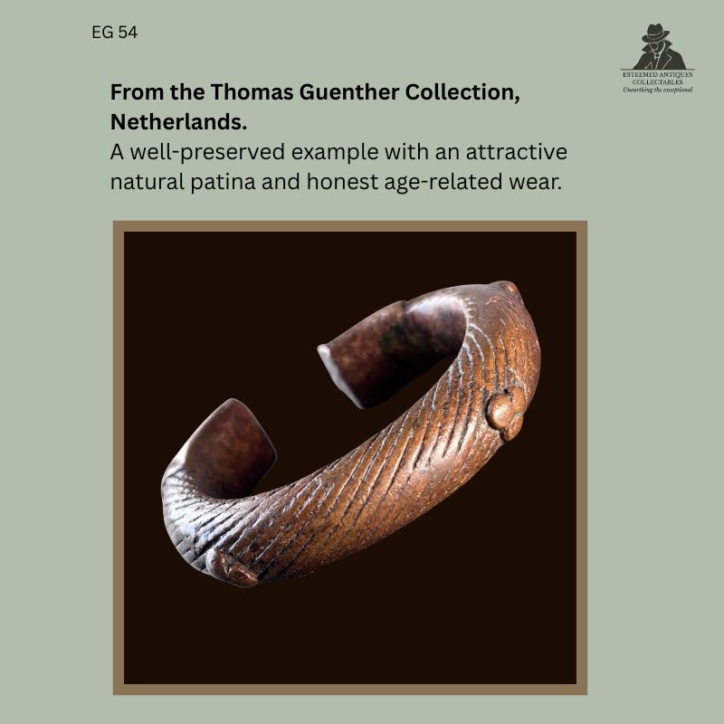 West African cast copper prestige bracelet produced by the lost-wax casting technique, featuring a ridged exterior with raised circular bosses and a rich natural patina, from the Egon Guenther Collection by family descent to the Thomas Guenther Collection, Netherlands.