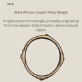 West African rigid closed-form copper-alloy bangle, probably from the western Côte d’Ivoire–Liberia cultural region, shown from above with three raised decorative projections.