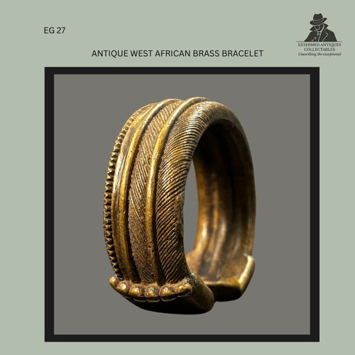 Front view of a West African cast brass bracelet with an open cuff form, decorated with raised bands, beaded borders, and finely incised geometric surface patterning. Produced using the lost-wax casting technique and originating from the Egon Guenther Collection, inherited by Thomas Guenther.