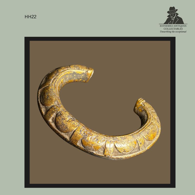 Open-ended West African cast brass currency bracelet with rounded terminals and incised geometric decoration, produced using the lost-wax casting technique. Collector-grade adornment and prestige object from the Hans Himmelheber Collection, later the Egon Guenther Collection and Thomas Guenther Collection.