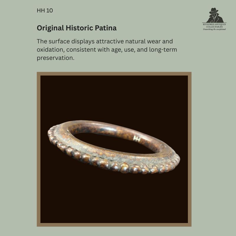 Close-up view of a West African lost-wax cast bronze bracelet showing original historic patina, natural oxidation and surface wear consistent with long-term use and preservation, from the Hans Himmelheber Collection with descent through the Egon Guenther Collection.