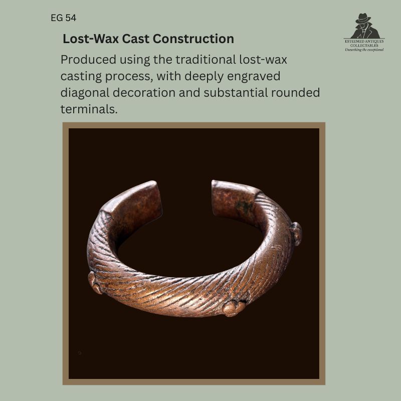Close-up view of a West African lost-wax cast copper prestige bracelet illustrating the traditional casting technique, with deeply engraved diagonal decoration, rounded terminals, and raised cast bosses. Provenance: Egon Guenther Collection, by family descent to the Thomas Guenther Collection.