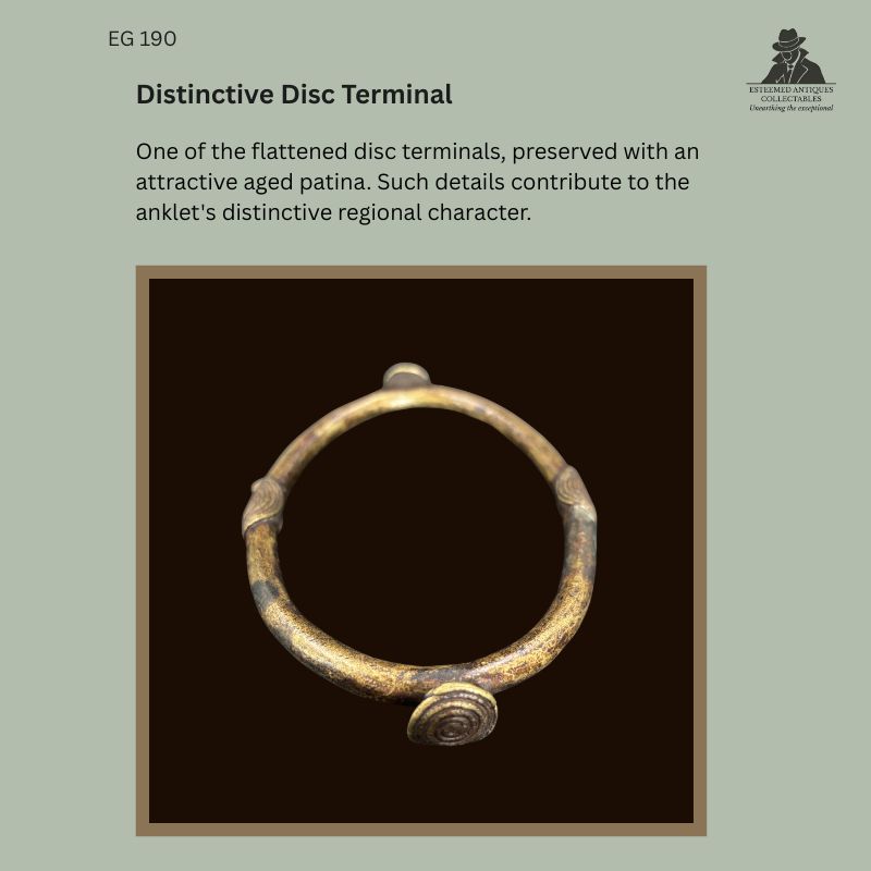 Detail view of the flattened disc terminal on a West African lost-wax cast copper-brass alloy prestige anklet, probably Gurunsi (Frafra), Northern Ghana, early 20th century, from the Egon Guenther Collection, showing the characteristic spiral-disc form and aged patina.