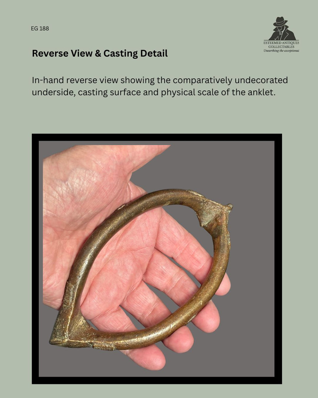 n-hand reverse view of West African lost-wax cast copper-brass prestige anklet EG 188, showing the comparatively undecorated underside, casting surface, curved form and physical scale; Egon Guenther Collection.