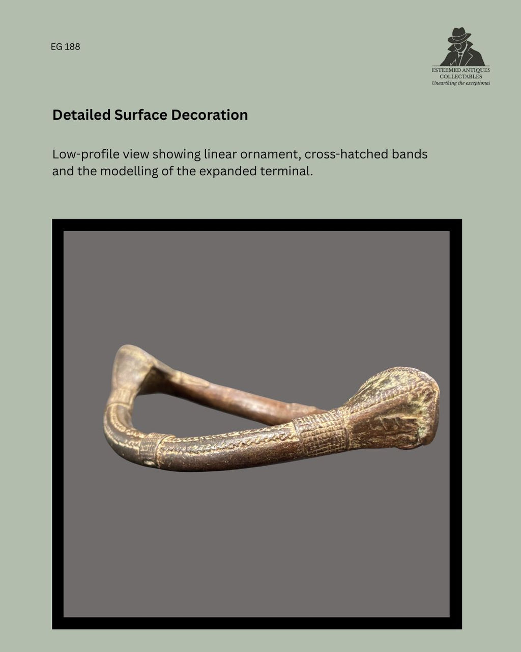 Low-profile detail of West African lost-wax cast copper-alloy prestige anklet EG 188, showing incised linear ornament, cross-hatched bands and the modelling of the expanded terminal.