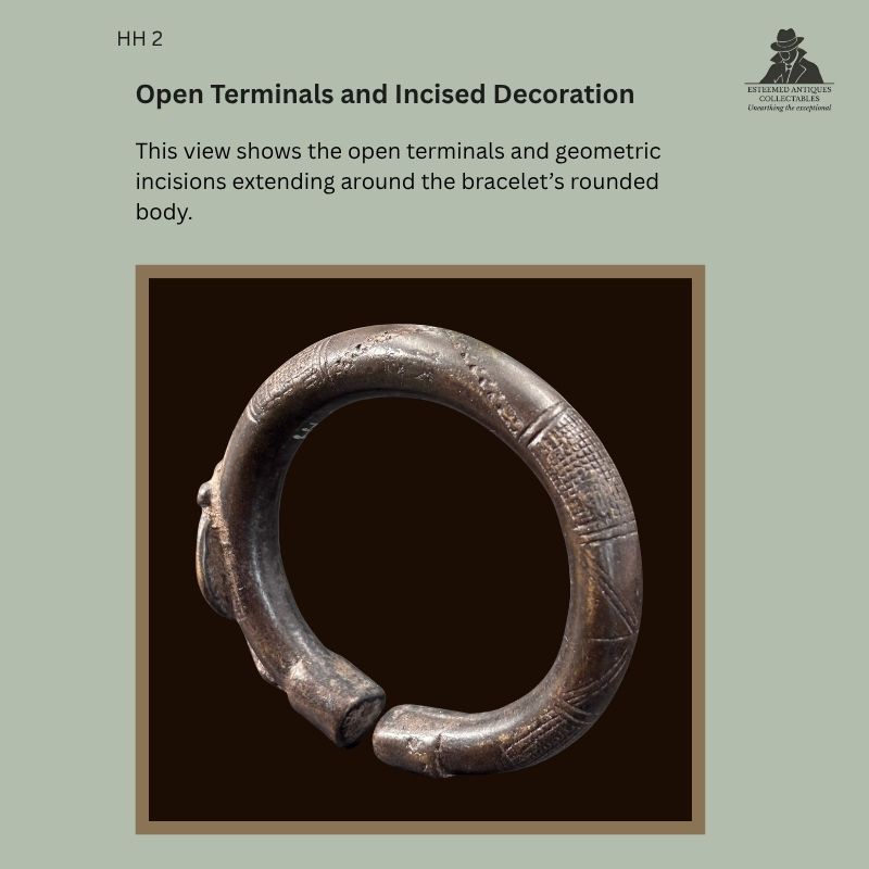Open terminals and geometric incised decoration on the rounded body of a West African copper-alloy bracelet, probably Senufo, with Hans Himmelheber provenance.