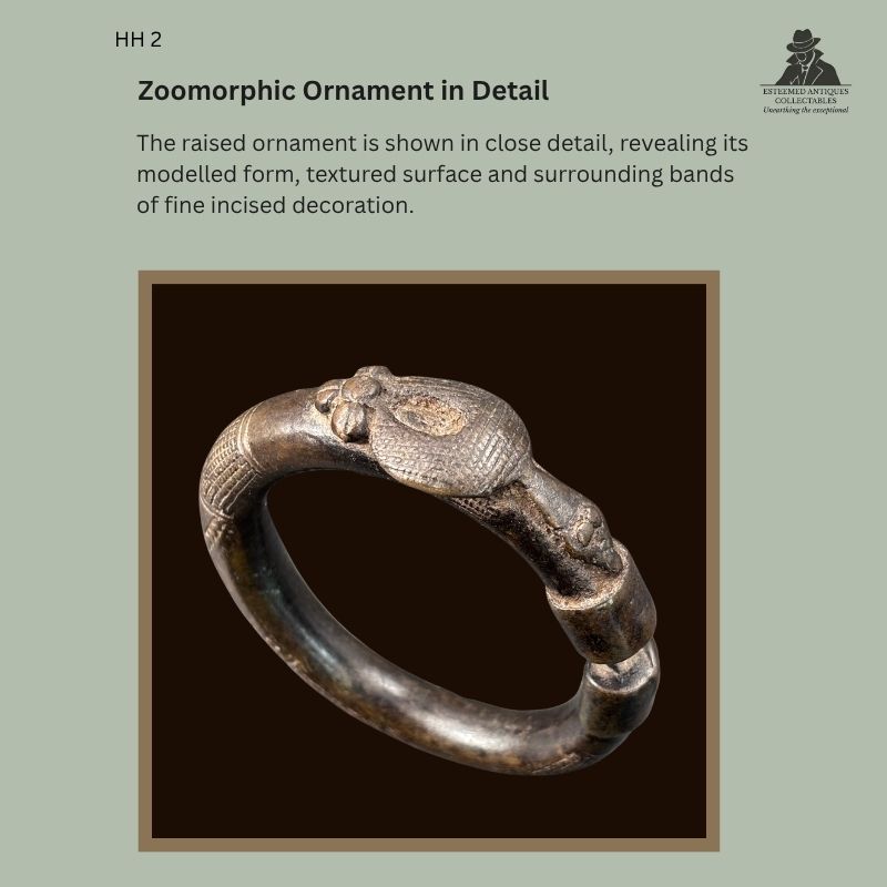 Detail view of the raised zoomorphic ornament and finely incised geometric bands on a lost-wax-cast West African copper-alloy bracelet, probably Senufo, with Hans Himmelheber provenance.