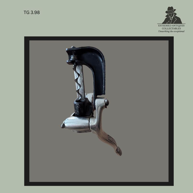 Complete front view of a Yankee No. 2 bar-mounted mechanical corkscrew with black japanned cast-iron frame, nickel-plated operating body, and exposed worm in the closed position, from the Thomas Guenther Collection.