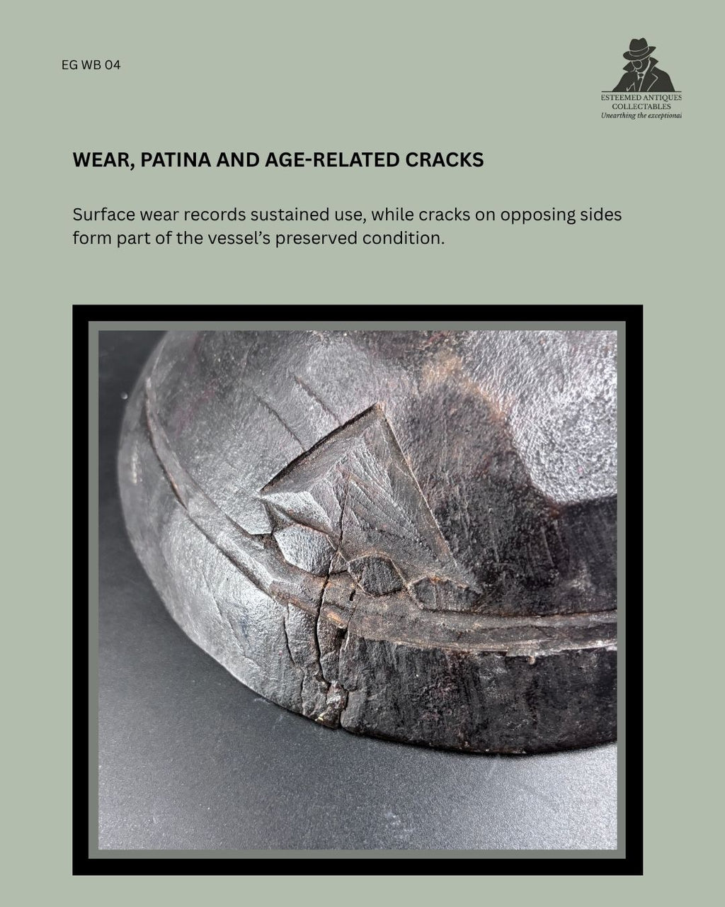 Close-up of the Zulu-attributed wooden ugqoko food dish showing dark patina, sustained surface wear and age-related cracks at the carved rim.